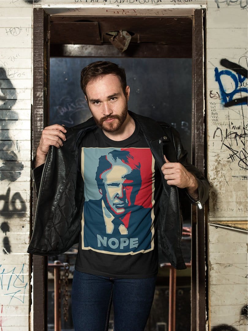Model wearing Nope Trump Bold Political Statement Graphic Tee Shirt in urban setting
