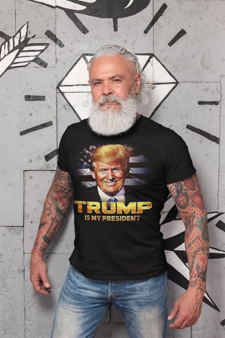 Man wearing Is My President Trump Patriotic Statement Tee Shirt in front of textured wall.