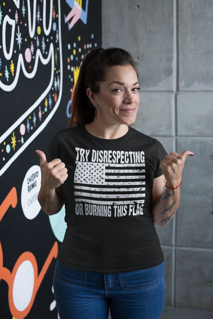 Woman wearing Try Disrespecting Or Burning This Flag shirt with American flag print.