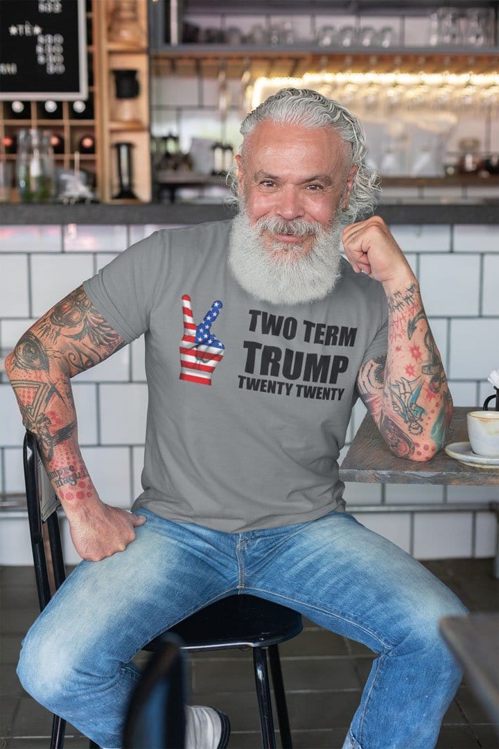 Man wearing Twenty Twenty Two Term Trump Supporter Graphic Tee at a café.