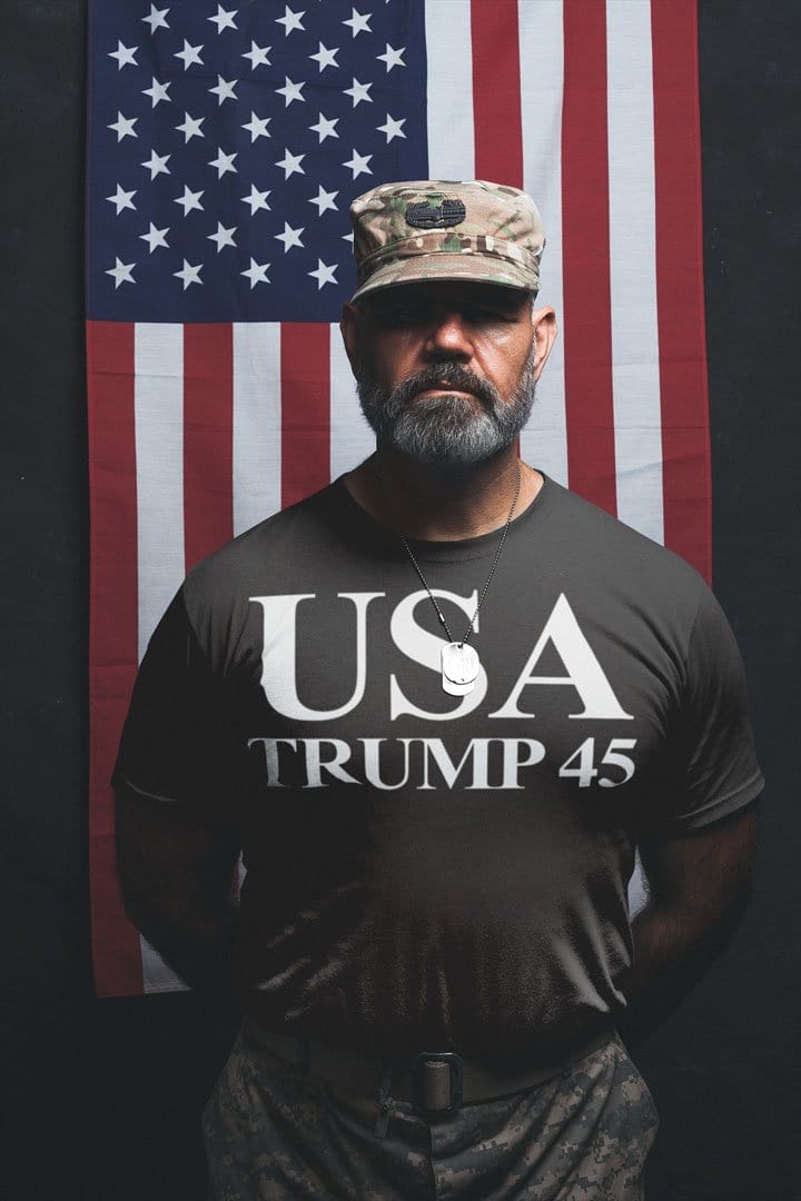 Man wearing USA 45 Trump Patriotic Supporter Graphic Tee Shirt in front of American flag