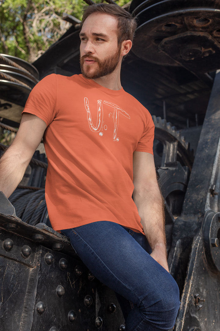 Man wearing University Of Tennessee Anti-Bullying Tee sitting outdoors.
