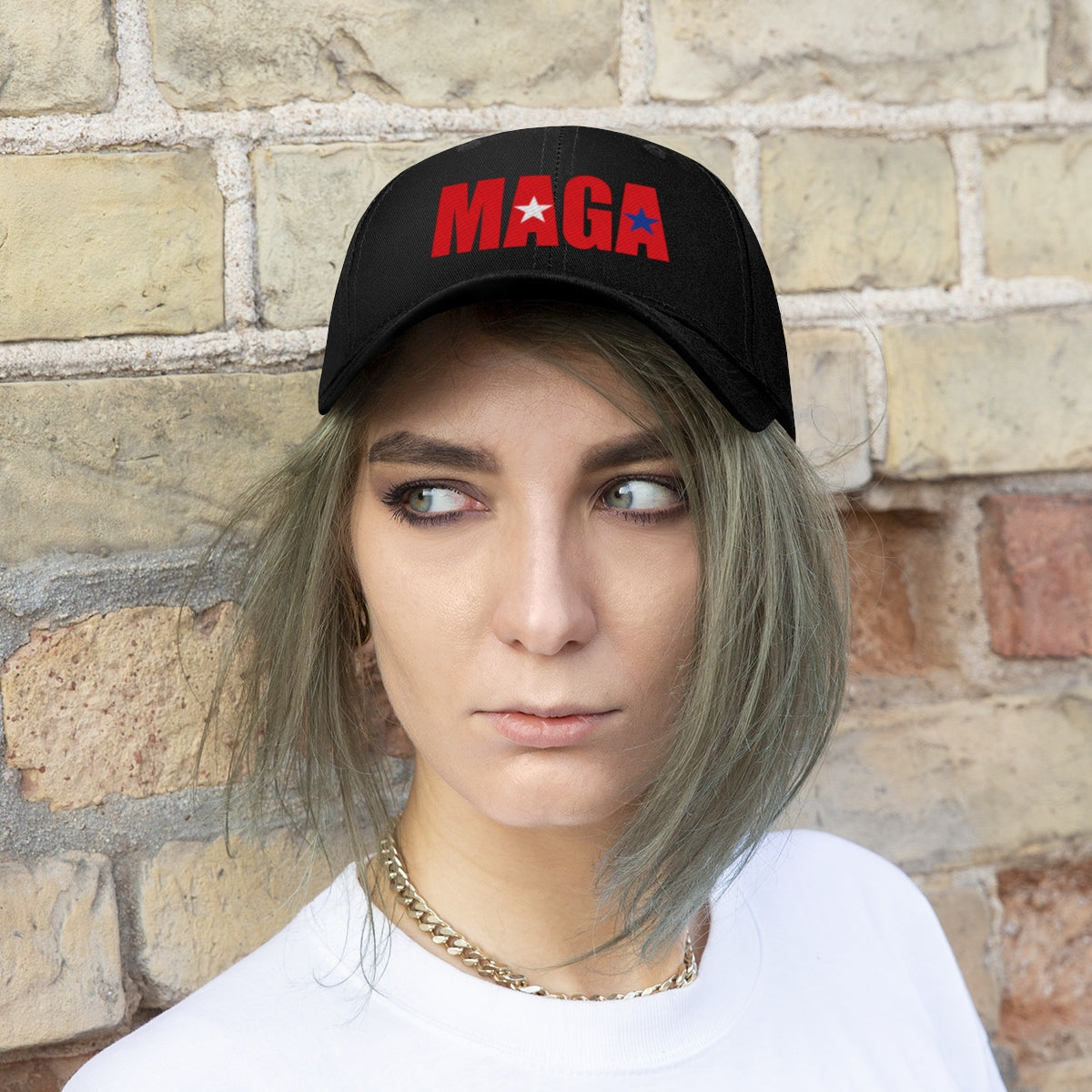 Embroidered MAGA Cotton Twill Cap Design worn by a model, featuring bold red and blue lettering on black cap.