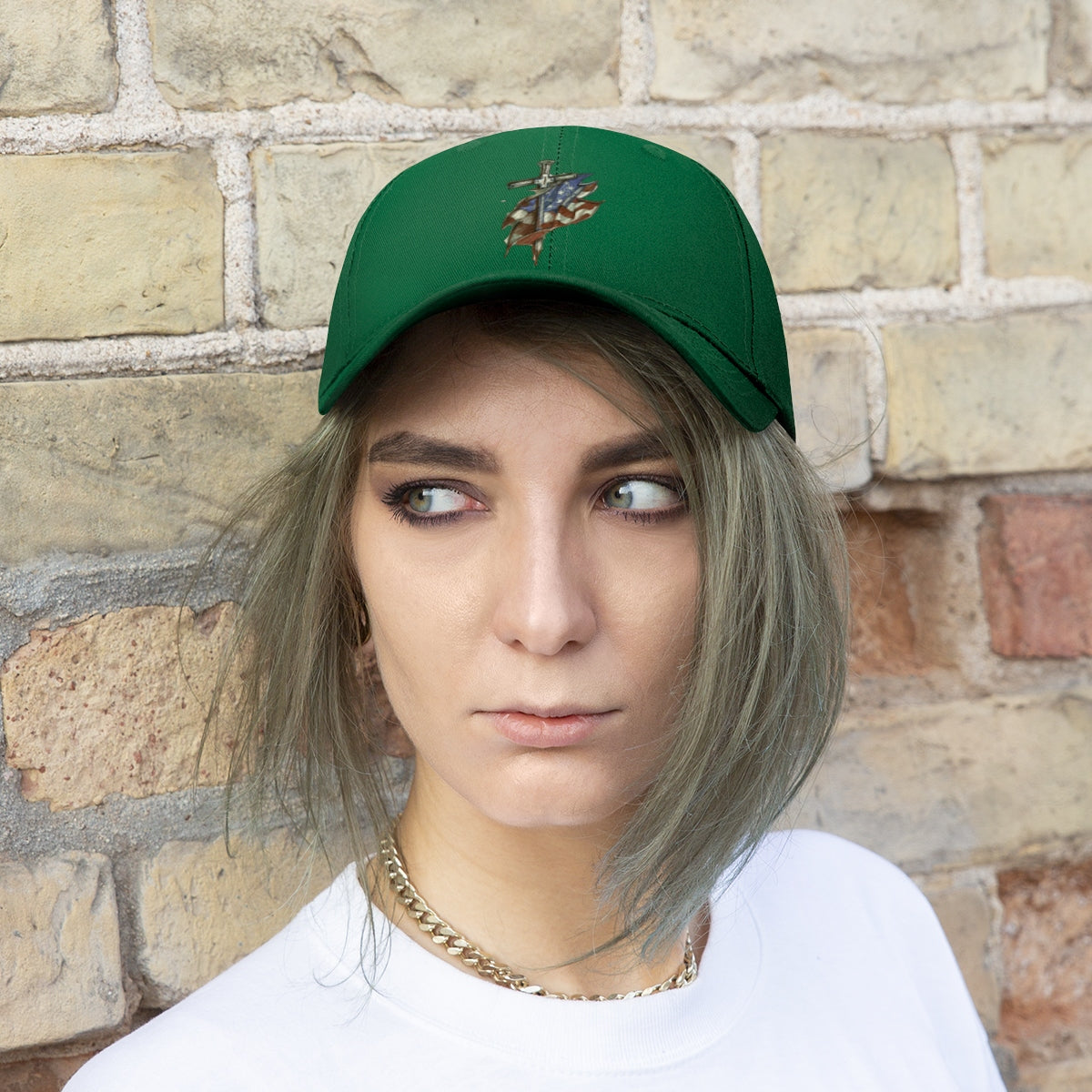 Dagger and Sword Embroidered Twill Cap in green, showcasing intricate weapon embroidery worn by a model.