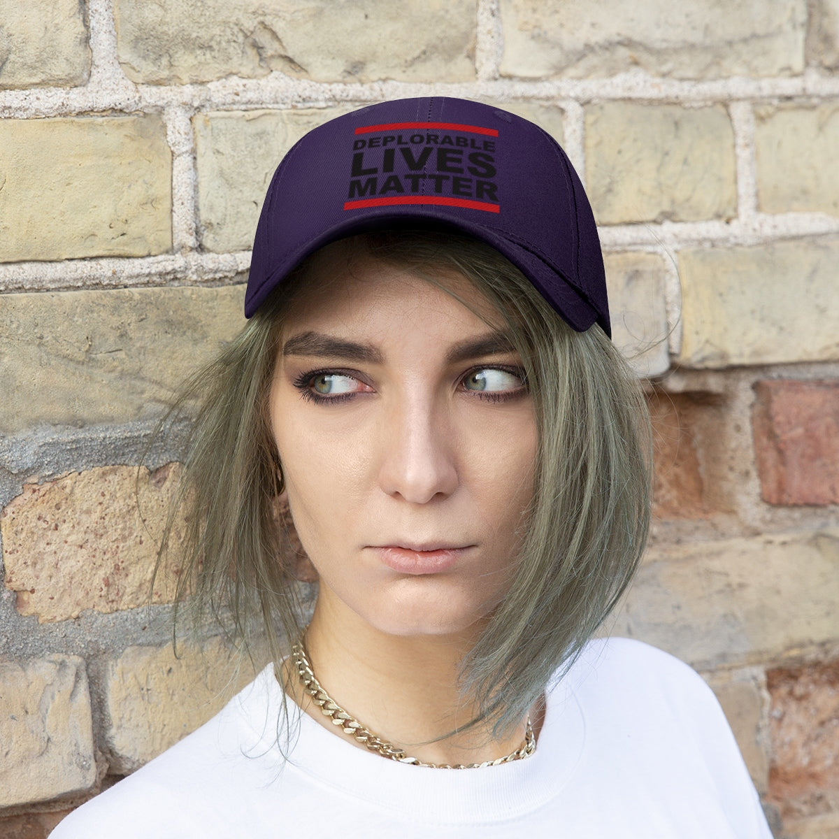 A model wearing the Deplorable Lives Matter Twill Cap against a brick wall.