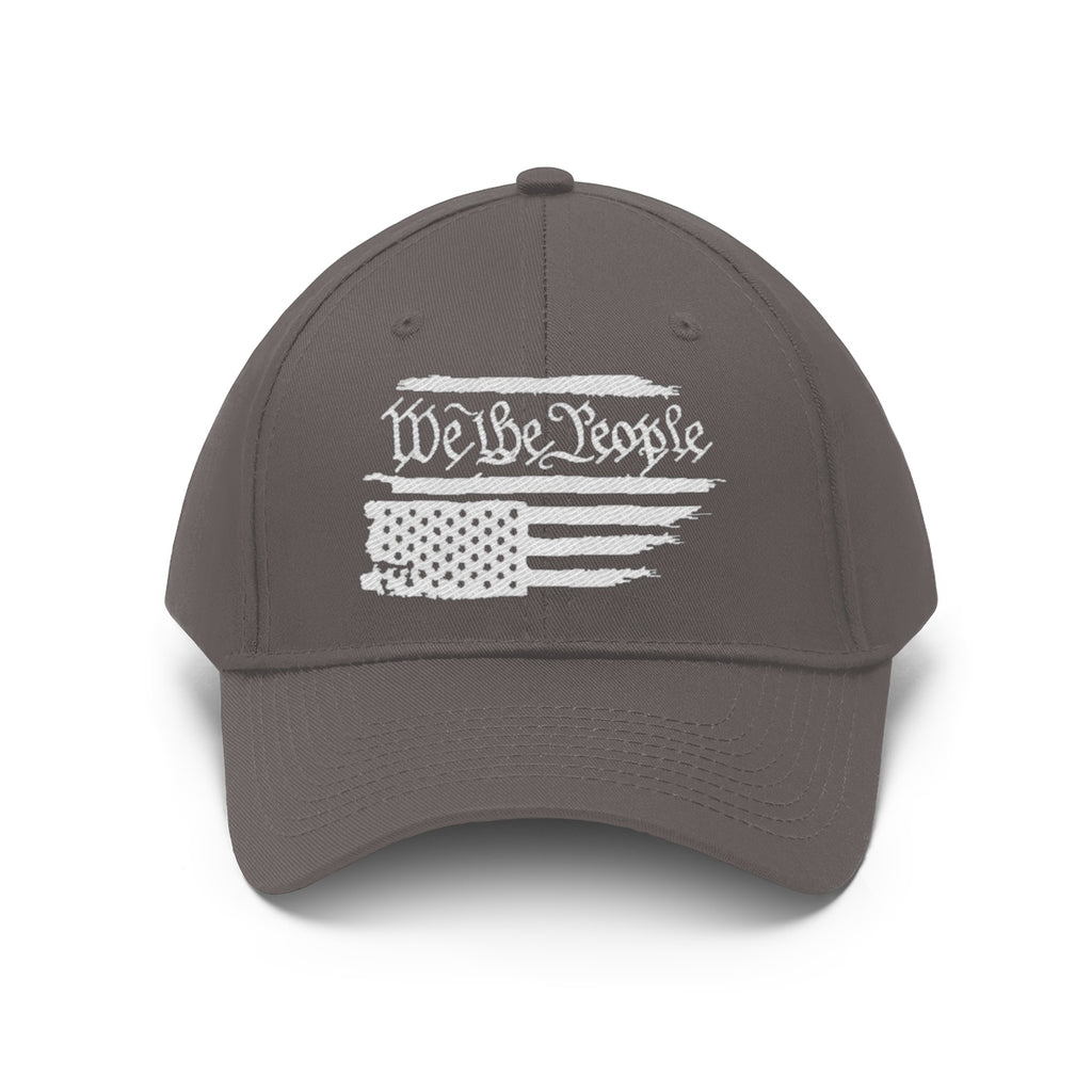 We The People On Distressed American Flag Twill Cap in gray color showcasing a distressed American flag design.