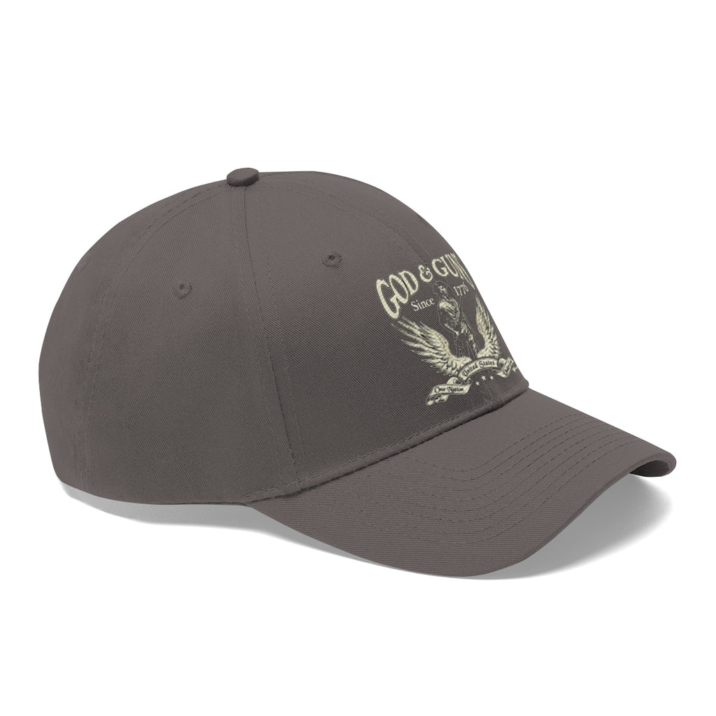 God And Guns Since 1776 Twill Cap in dark gray, showcasing a patriotic design with eagle emblem.