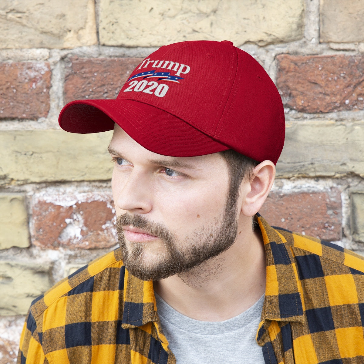 Man wearing a red Patriotic 2020 Twill Cap for Trump, showcasing his support for the campaign.