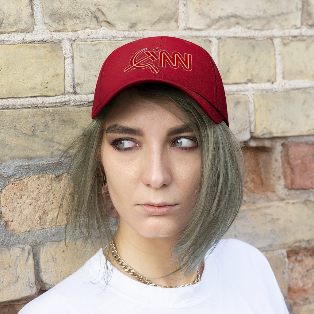 CNN Logo as Hammer and Sickle Twill Cap worn by a model against a brick wall background.