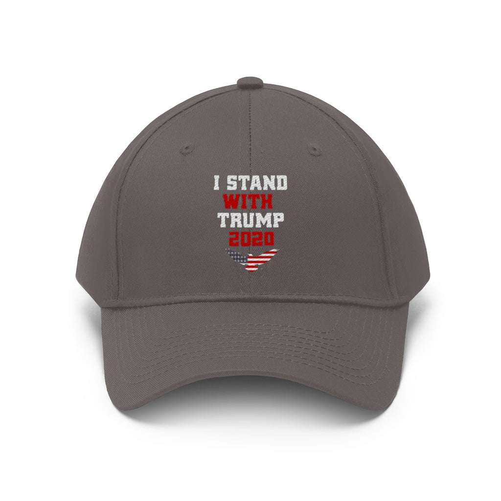 I Stand With Trump 2020 Twill Cap featuring bold text and American flag design on a gray cap.