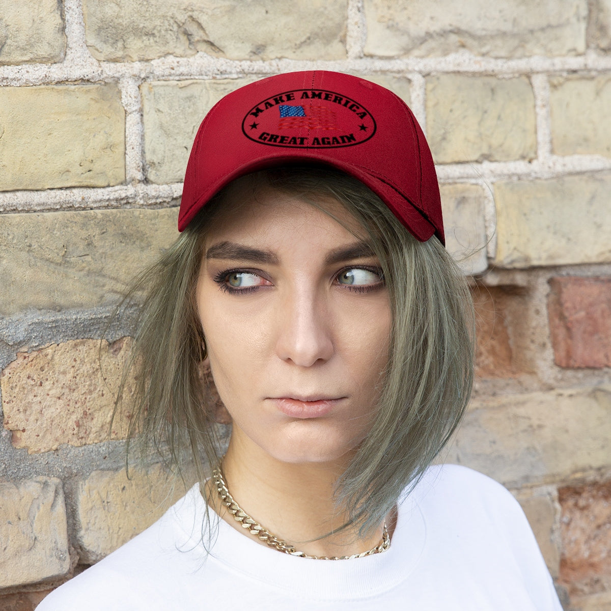 Make America Great Again US Flag Twill Cap on a model with a neutral expression against a textured wall.