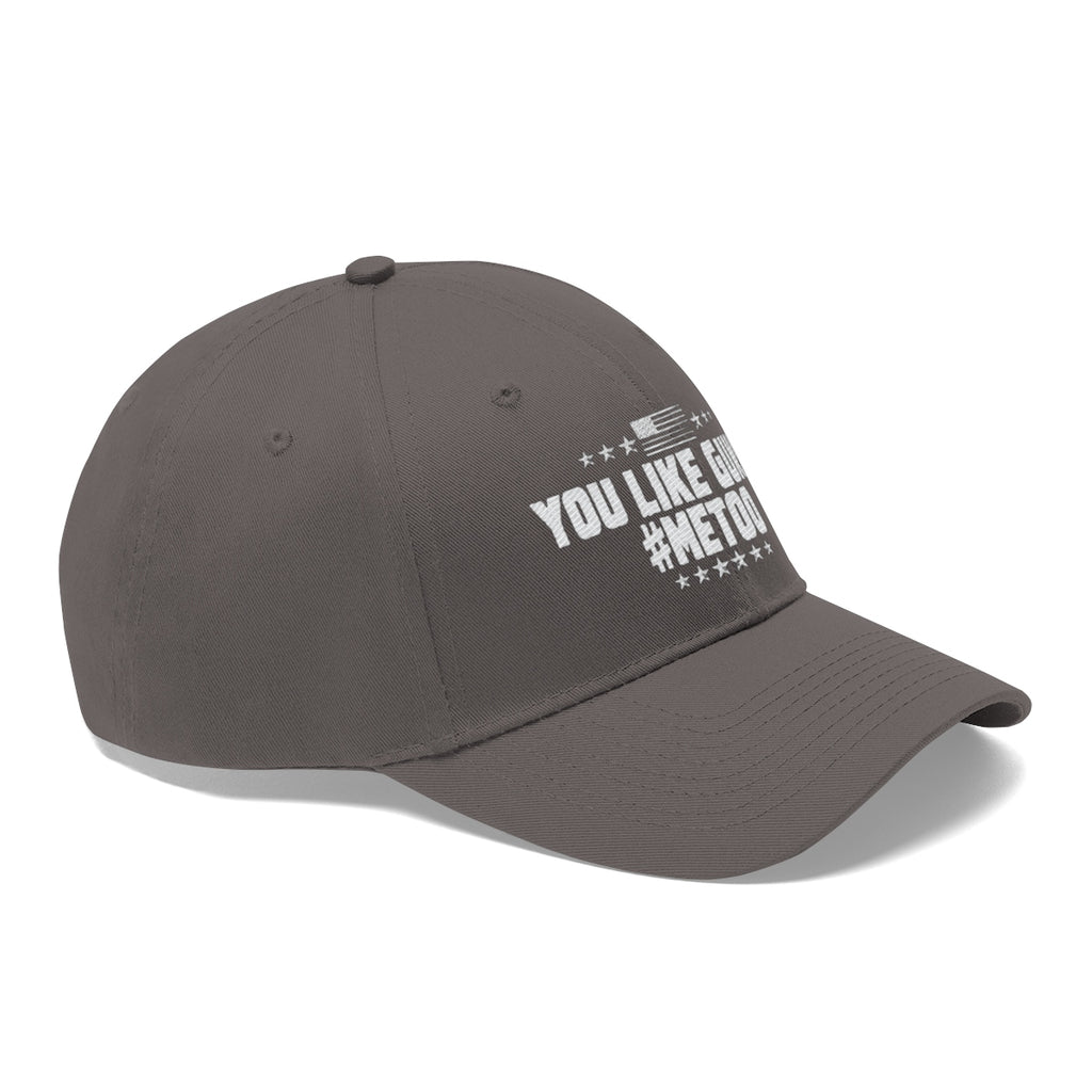 You Like Guns Me Too Twill Cap showcasing a gray dad hat with bold white text and patriotic design.