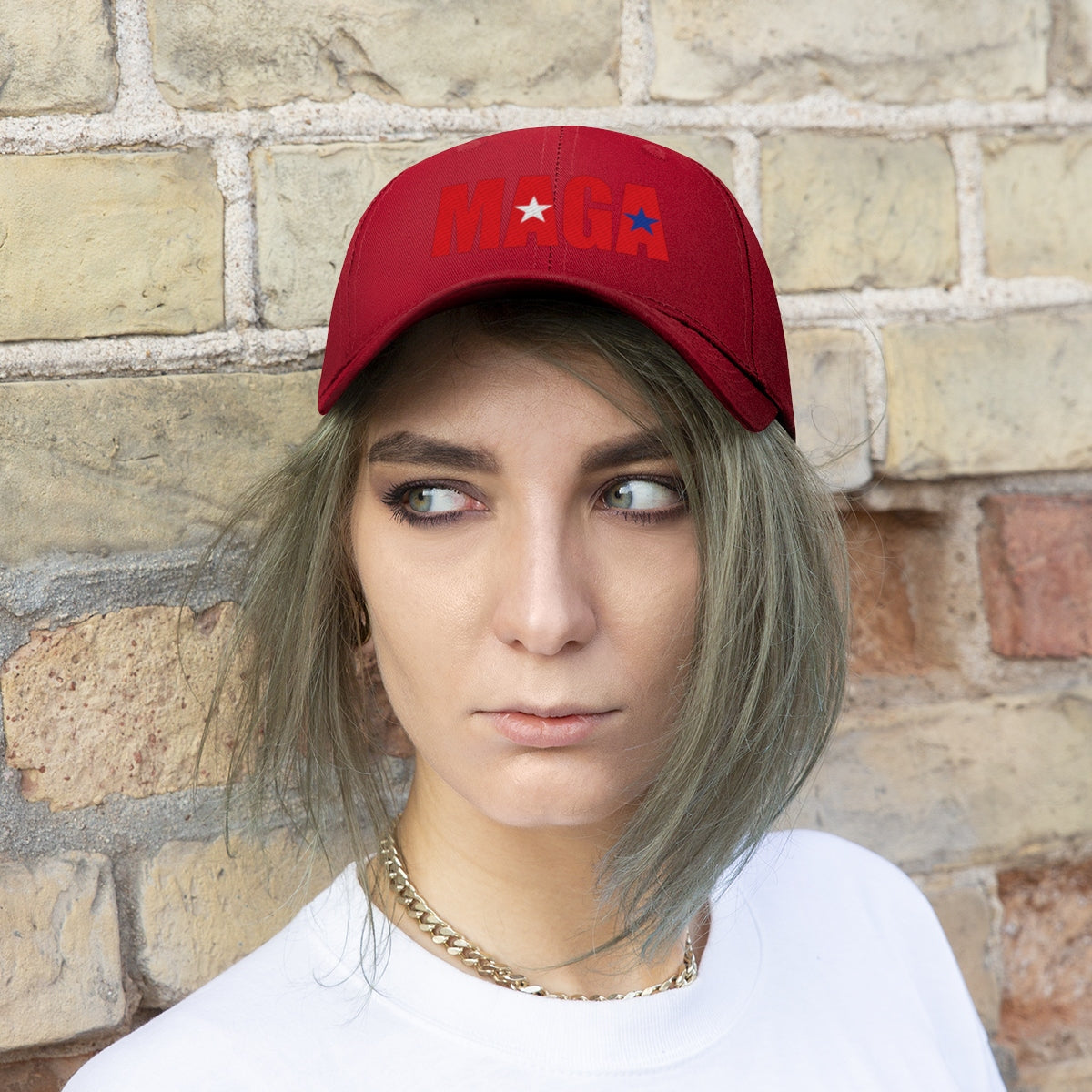 Embroidered MAGA Cotton Twill Cap Design worn by a model against a brick wall background.