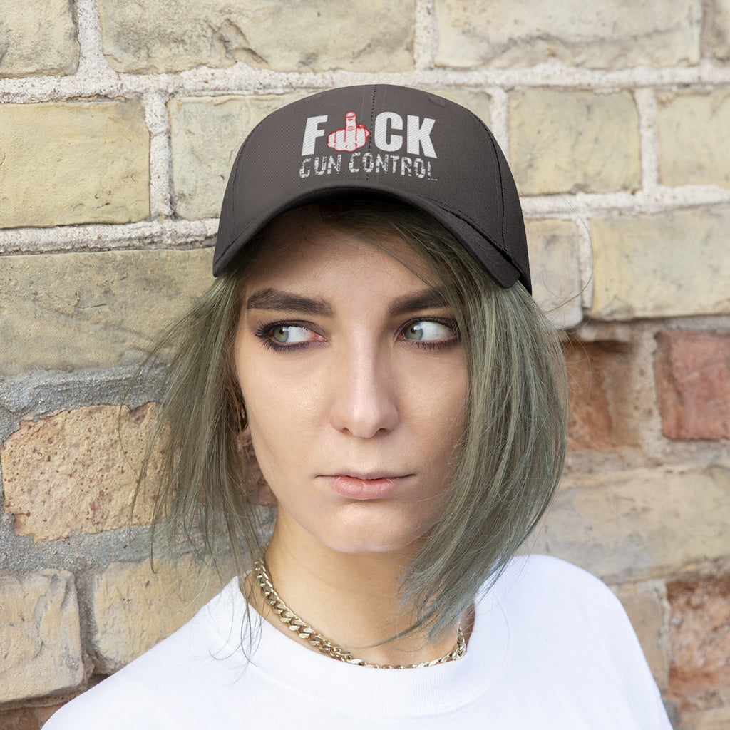 Fuck Gun Control Red Finger Twill Baseball Cap worn by a model against a brick wall background.