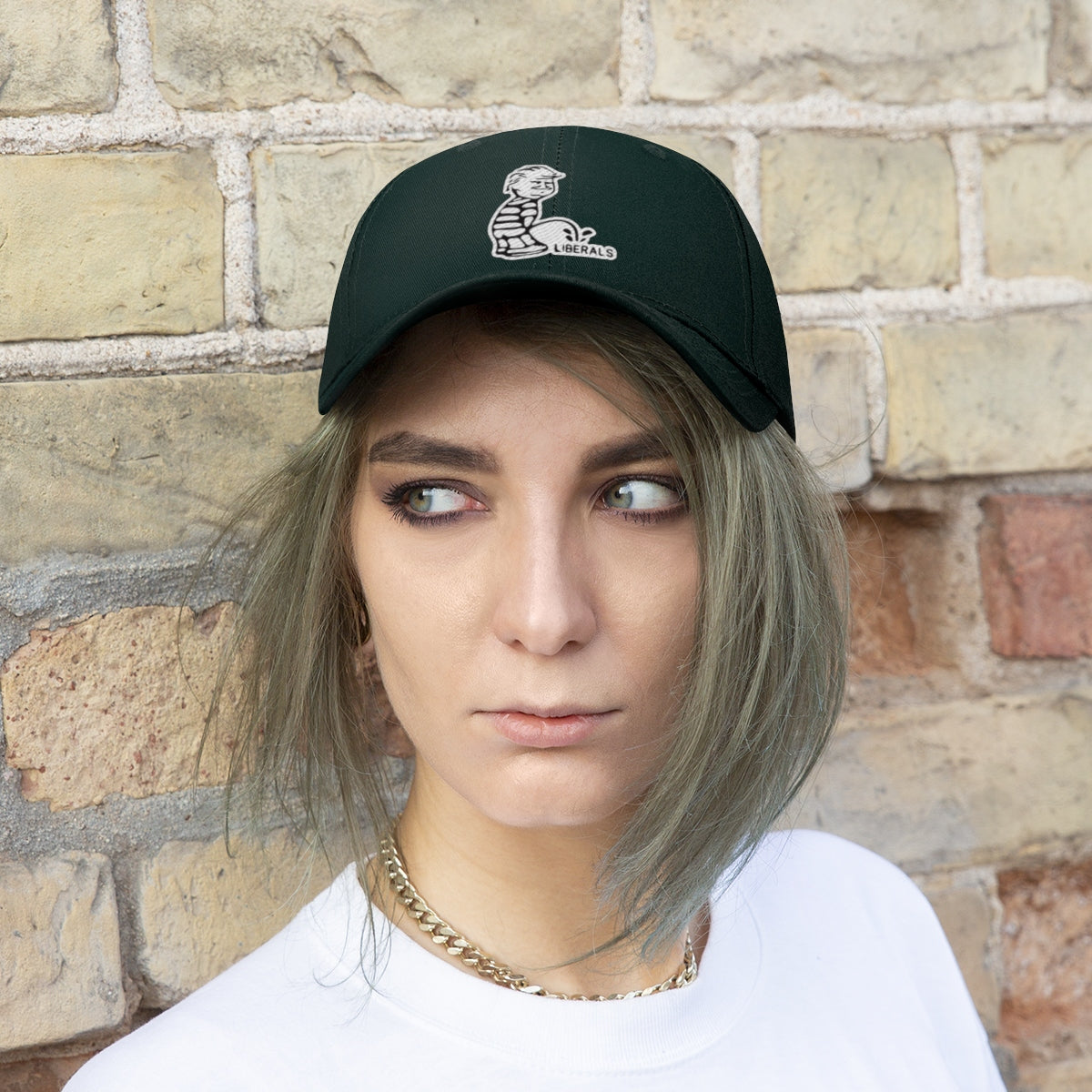 Trump USA Pride Embroidered Twill Cap worn by a model against a brick wall background.