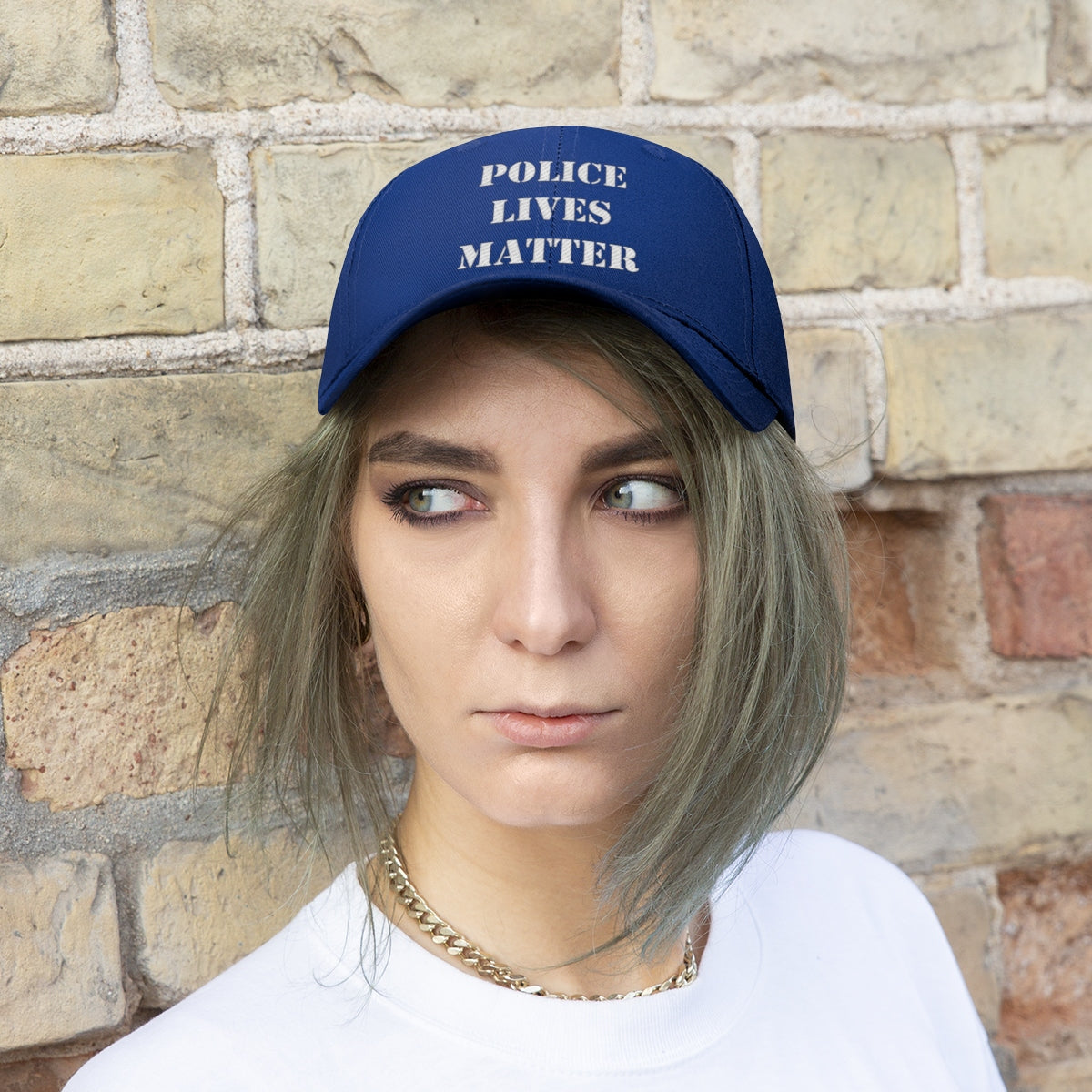 Embroidered Police Lives Matter Twill Cap worn by a model with a neutral expression against a textured wall.
