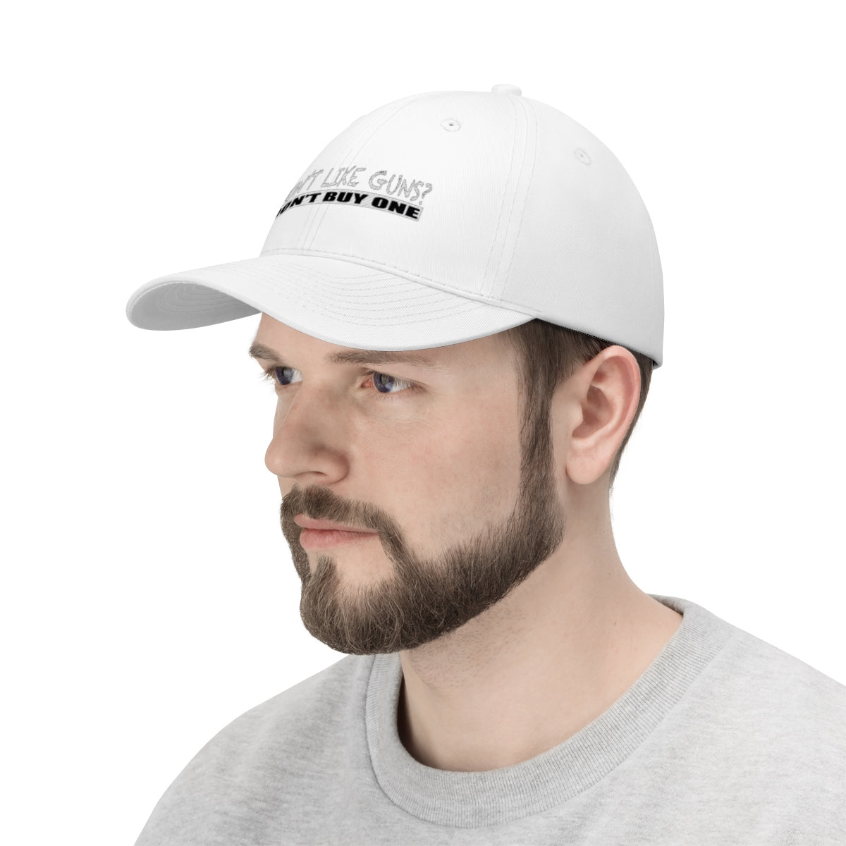 A model wearing a Don't Like Guns Don't Buy One Twill Cap, showcasing its unique statement design.