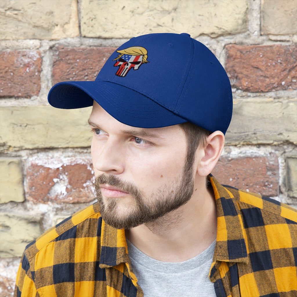 Classic Punisher Twill Cap with Trump Design worn by a man against a brick wall backdrop.