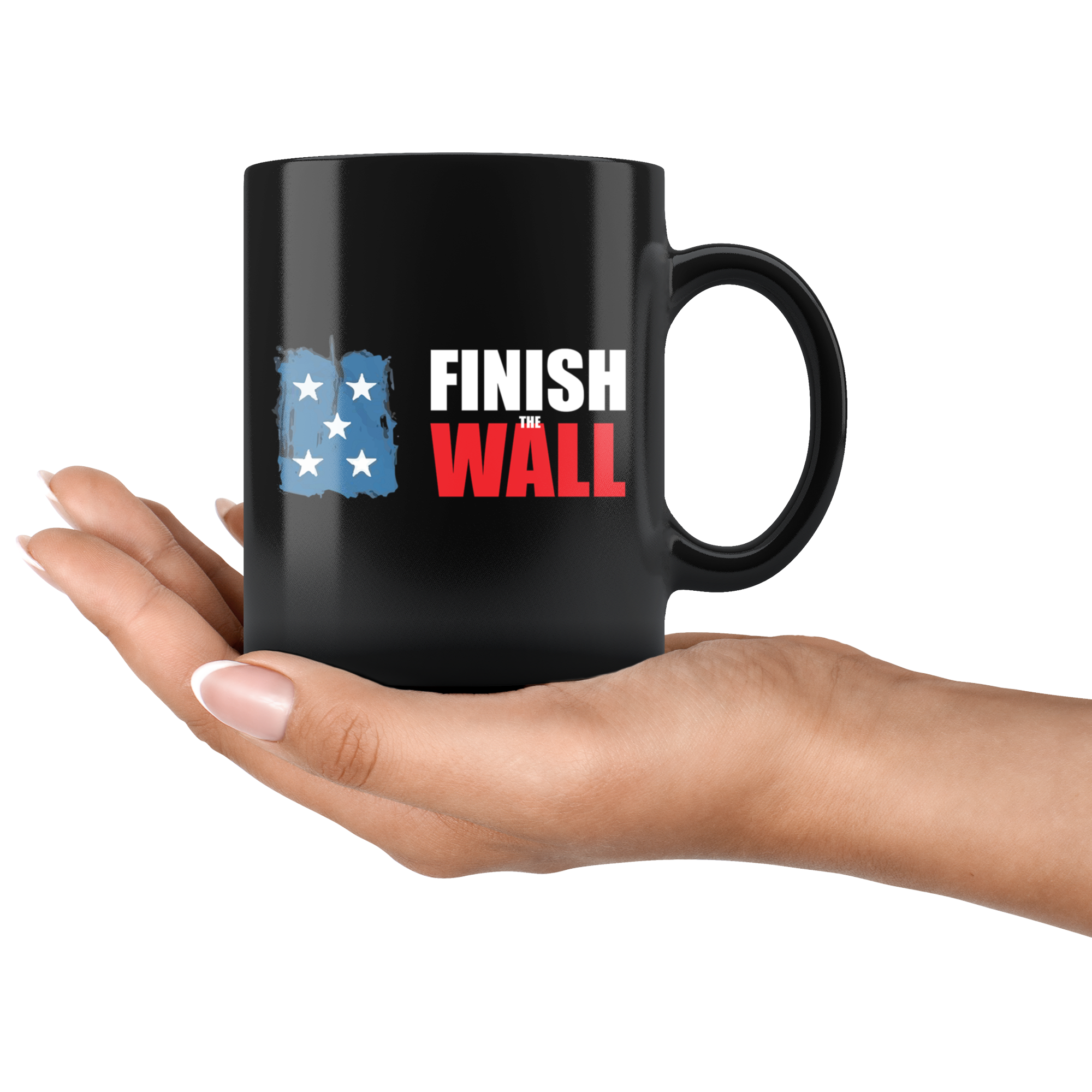 Hand holding a Finish The Wall Ceramic Coffee Mug with high gloss black finish, featuring vibrant design, perfect for hot and cold beverages.