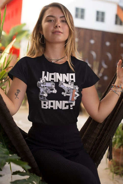 Person wearing t-shirt with Cartoon Pistols Funny Graphic Design sitting in a hammock.