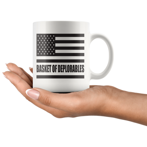 Basket of Deplorables Patriotic Graphic ceramic mug held in hand, featuring American flag design, premium white finish, and ORCA coating.
